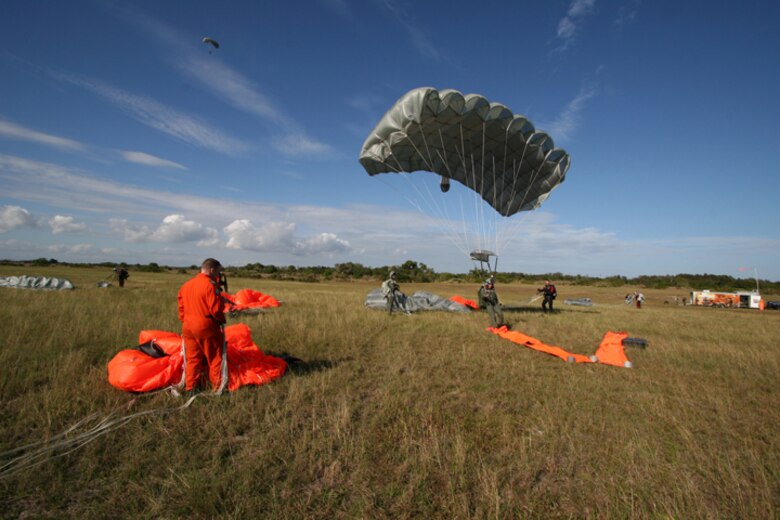 Executing a High Altitude Low Opening parachute drop, pararescuemen from the Air Force Reserve's 920th Rescue Wing at Patrick Air Force Base train with Canadian Rescue Forces from the 435th Air Transport and Rescue Squadron based in Winnipeg, Canada during an International Search and Rescue Exercise Jan, 4 - 8.  (U.S. Air Force Photo by Tech Sgt. Robert Grande)