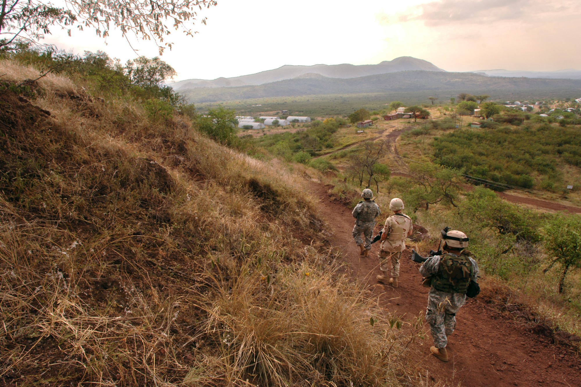 Airman 1st Class Steven Brumley, middle, takes part in a two-mile hike with Guam Army National Guardsmen Specialists Albert Samana and Manno Raigelig as part of a weekly fitness regiment. All are deployed to Contingency Operating Location Bilate, Ethiopia. (U.S. Air Force photo/Master Sgt. Scott Wagers)