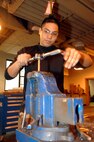 MINOT AIR FORCE BASE, N.D. -- Airman 1st Class Tim Sinogo, 5th Maintenance Squadron, threads bolts in the metals shop here Jan. 5. The bolts will be used for a munitions holding unit, which attaches to a B-52H Stratofortress. (U.S. Air Force photo by Airman 1st Class Christopher Boitz)