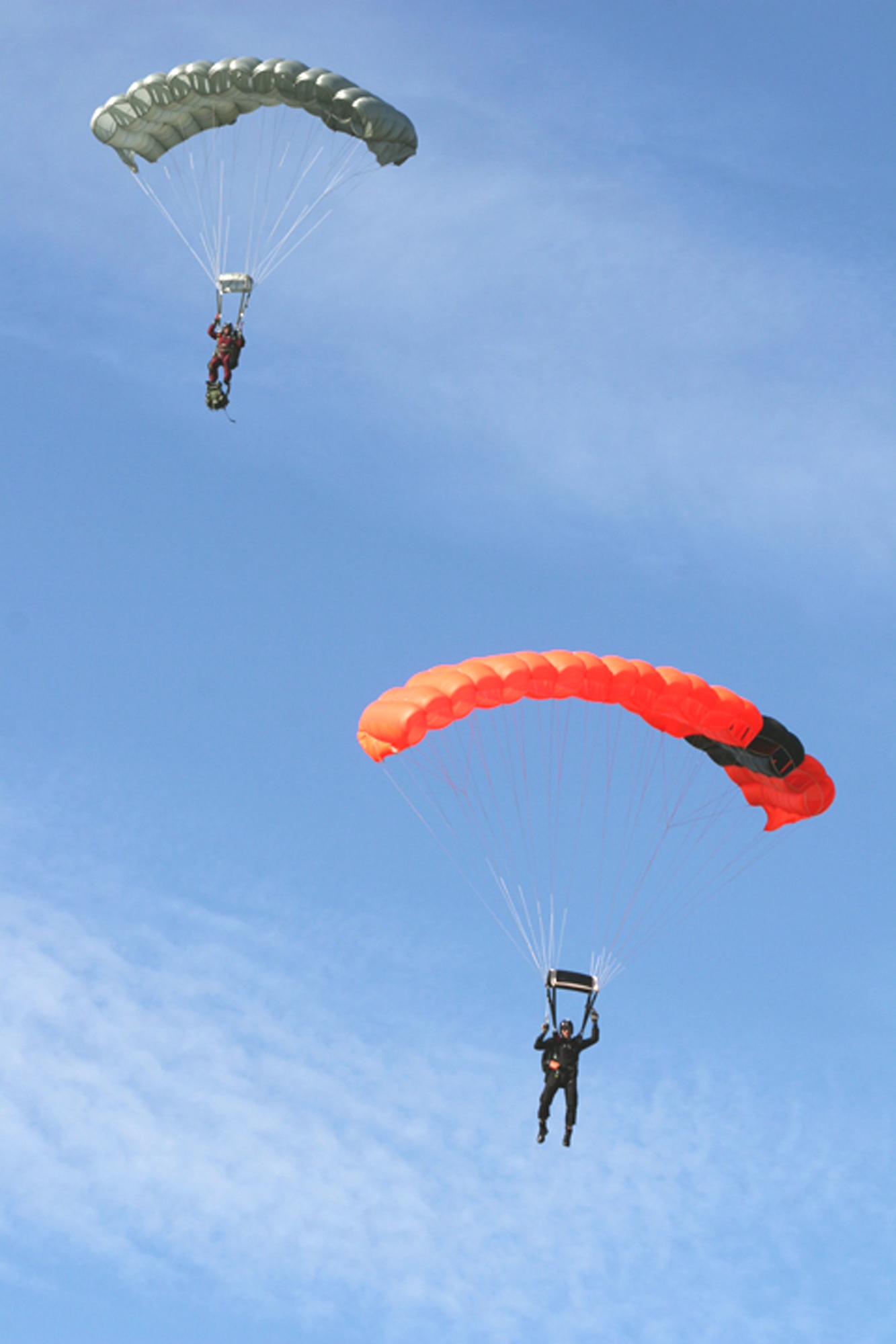 American and Canadian pararescue jumpers descend onto Cape Canaveral Air Station, Fla., on Jan. 5 as part of an international search and rescue exercise. Air Force Reserve Command PJs from the 920th Rescue Wing at Patrick Air Force Base, Fla., participated with Canadian rescue forces from the 435th Air Transport and Rescue Squadron based in Winnipeg, Manitoba. (U.S. Air Force photo/Tech. Sgt. Robert Grande)