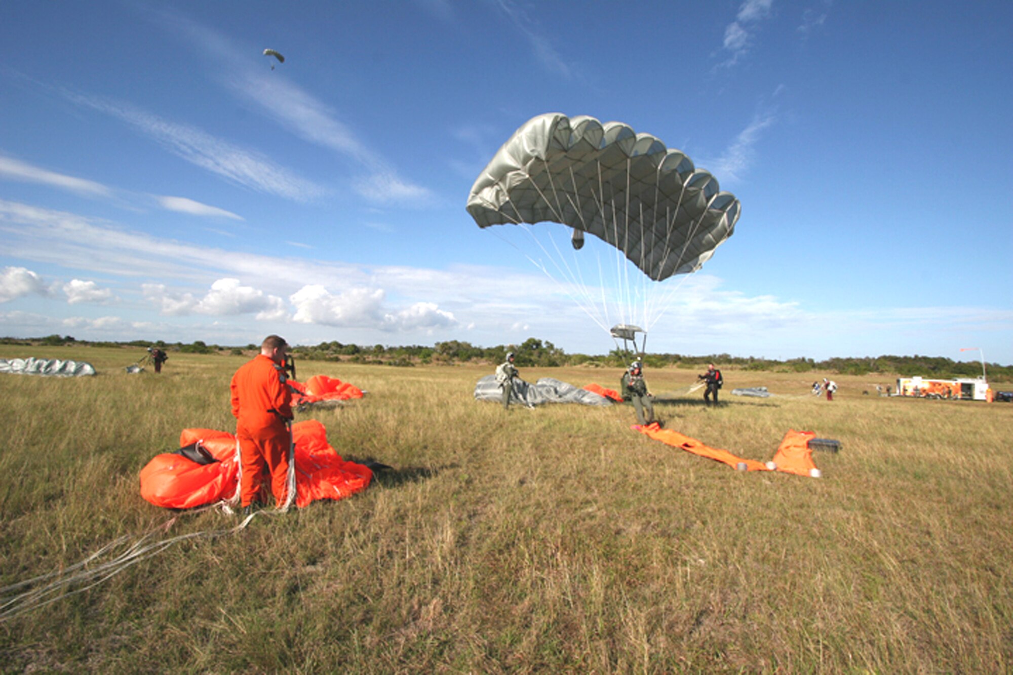 American and Canadian pararescue jumpers recover their equipment as part of an international search and rescue exercise Jan. 5 at Cape Canaveral Air Station, Fla. Air Force Reserve Command PJs from the 920th Rescue Wing at Patrick Air Force Base, Fla., participated with Canadian rescue forces from the 435th Air Transport and Rescue Squadron based in Winnipeg, Manitoba. (U.S. Air Force photo/Tech. Sgt. Robert Grande)
