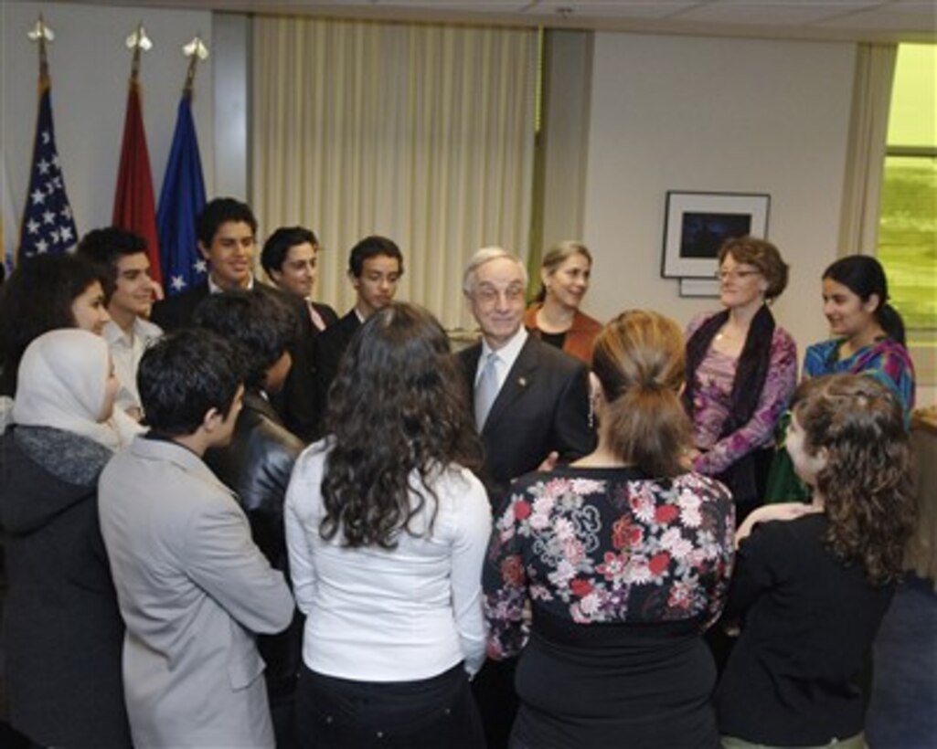 Deputy Secretary Gordon England (center) meets with students with the Aspect Foundation in the Pentagon on Jan. 8, 2007.  The non-profit agency has placed a group of Muslim faith students from Eurasian countries in homes in Virginia and in the schools, to create opportunities for our American students to interact with these young people.  All hope to serve as "young ambassadors for peace" through their 10 months here in the Youth Studies Exchange Program supported by the State Department. 