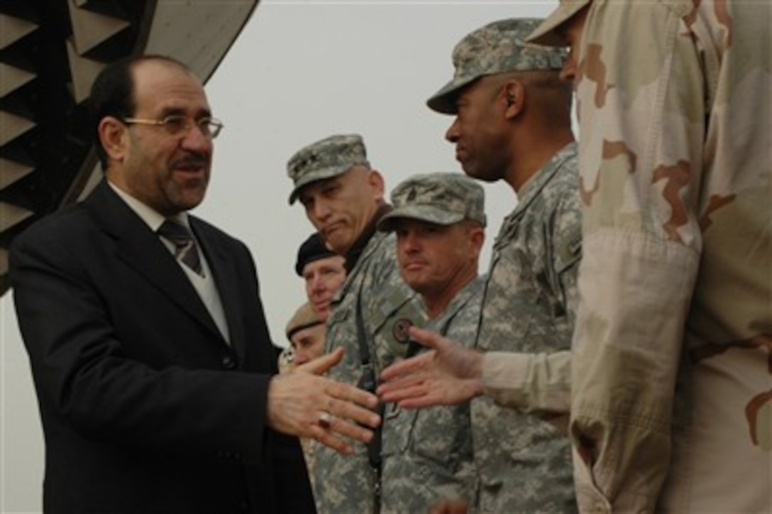 Iraqi Prime Minister Nouri al-Maliki shakes hands with U.S. servicemembers during Iraqi Army Day, a celebration marking the 86th birthday of the Iraqi army, at the Tomb of the Unknown Soldier in Baghdad, Iraq, Jan. 6, 2007. The event was attended by military and civilian leaders from both the United States and Iraq.