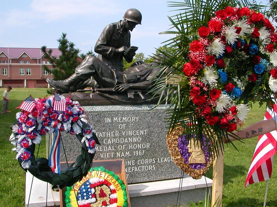 A monument to Navy Lt. Vincent Capodanno, the ?Grunt Padre,? was decorated with wreaths in Fort Wadsworth here last week on the 40th anniversary of his heroism and sacrifice in Vietnam.  Capodanno was posthumously awarded the Medal of Honor for his actions as chaplain of 3rd Battalion, 5th Marine Regiment, and is memorialized each year by Marines, sailors, chaplains, veterans and many others at the chapel bearing his name.