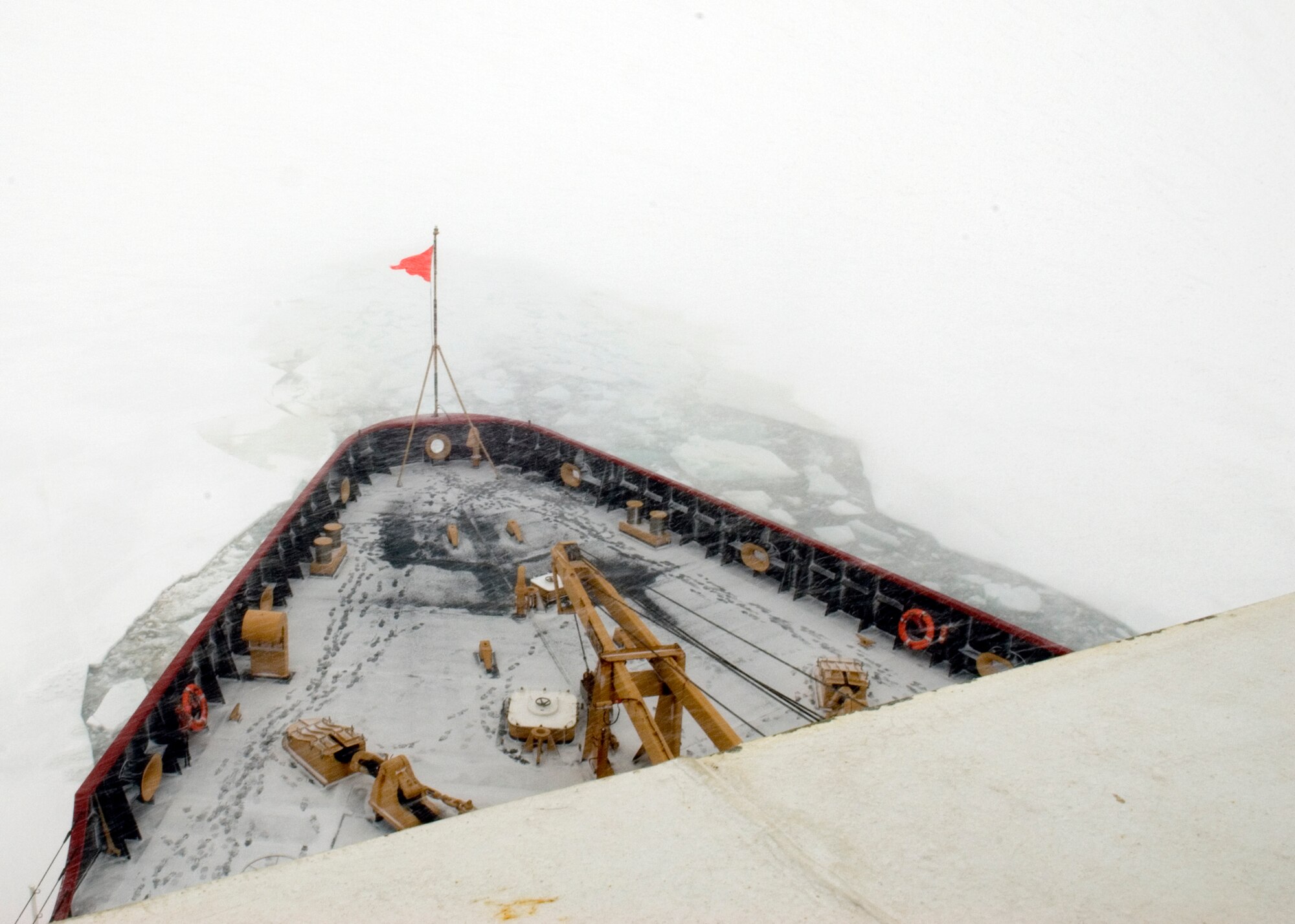 Antarctica - The Coast Guard Cutter Polar Sea plows through the ice shelf, and an Antarctic blizzard, in the Waddell Sea.  As part of the Air Force-led Joint Task Force Support Forces Antarctica, Operation Deep Freeze 2007, the Polar Sea's mission is to clear a navigable channel to McMurdo, Antarctica for supply ships to get in with needed equipment and goods for scientists working there.  U. S. Coast Guard photo by Petty Officer 3rd Class Kevin Neff.