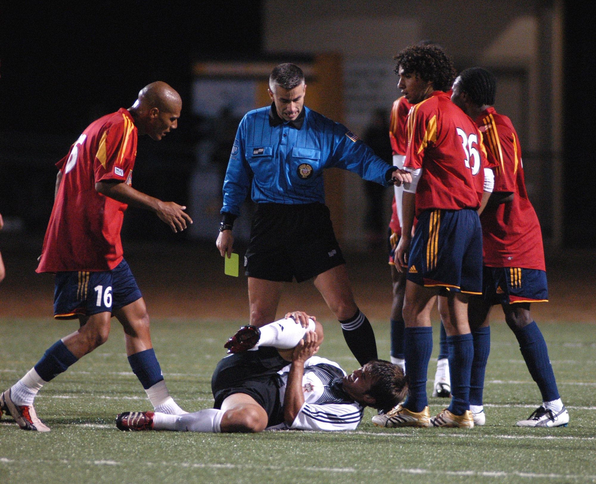 MSgt Oscar Ortiz hands out a yellow card after a foul