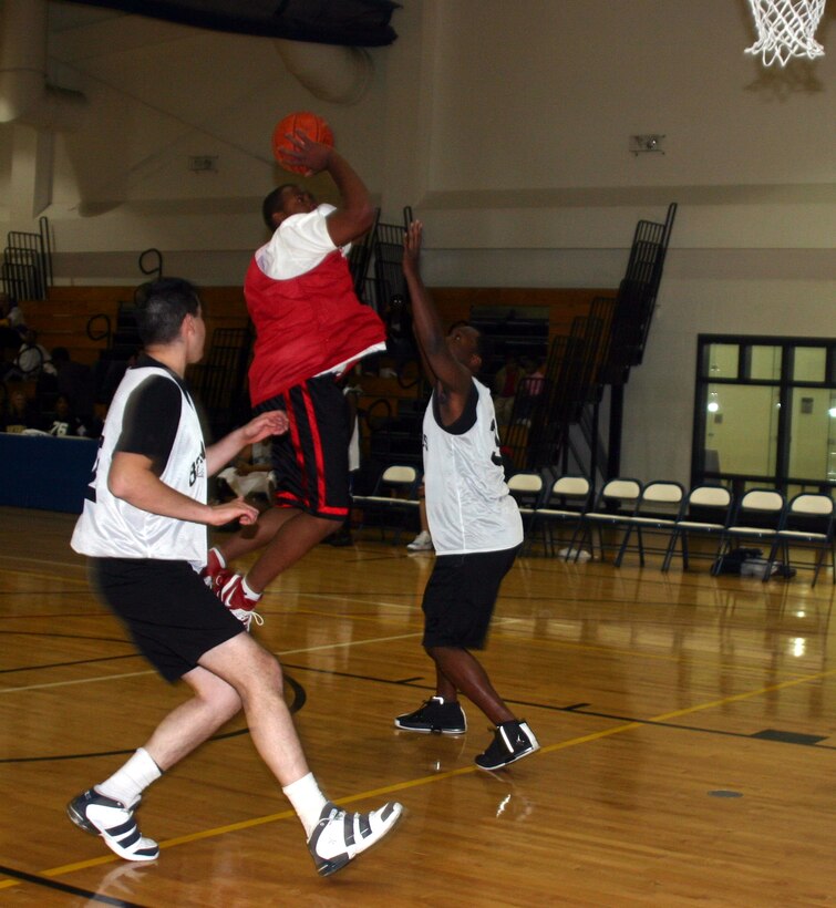 Jamar Davis, 82nd Contracting Squadron, makes a jump shot in the 82nd CONS game against the 82nd Medical Operations Squadron Jan. 8. The 82nd CONS won 67-30, taking their record to 5-0.