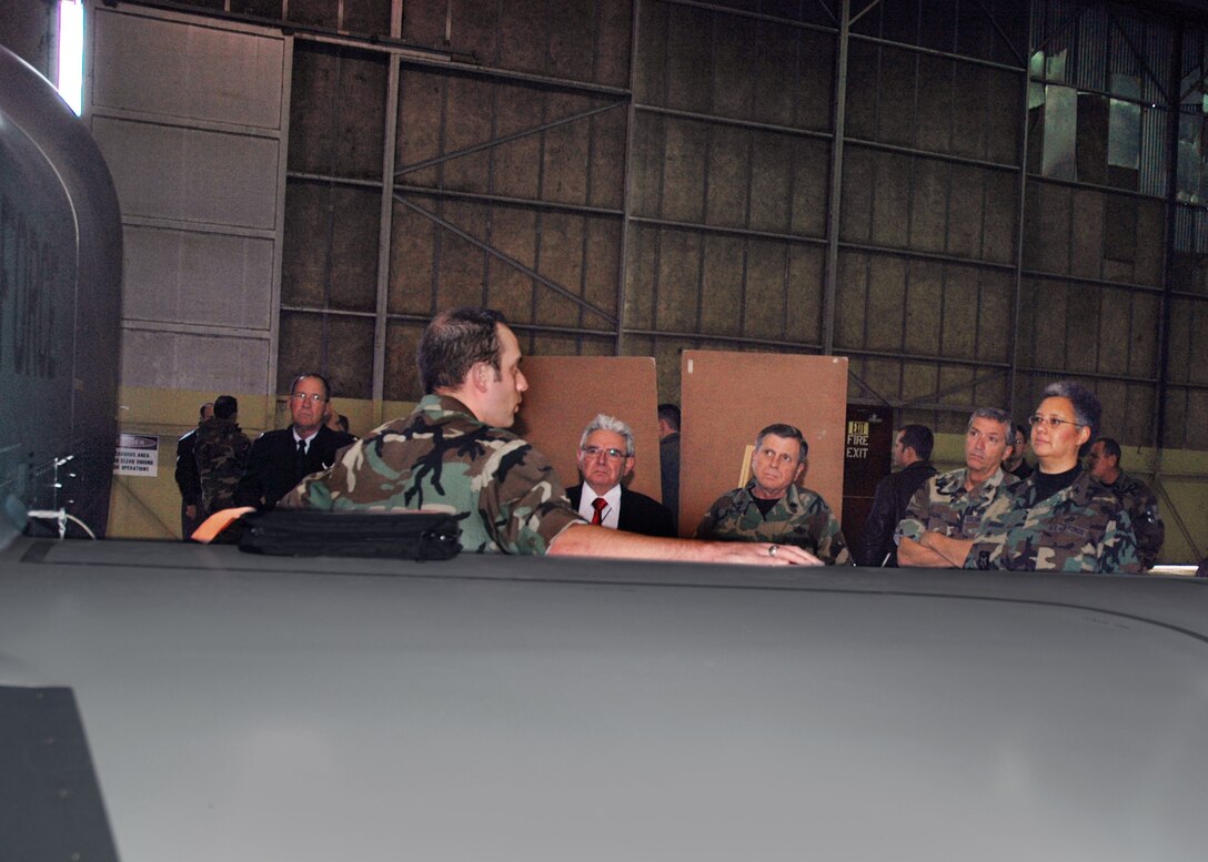 1/6/2007 -- 1st Lt. Christopher Cheshire, maintenance officer with the Air Force Reserve's 13th Reconnaissance Squadron, briefs the RQ-4 Global Hawk to Col Jeanne M. Haddad (right), deputy chief of intelligence and information operations for Air Force Reserve Command,  and other members of a fact-finding team visiting Beale Air Force Base, Calif. The team was gathering information on Reserve support of emerging Air Force missions. (U.S. Air Force photo/Master Sgt. Ellen Hatfield Wilt)