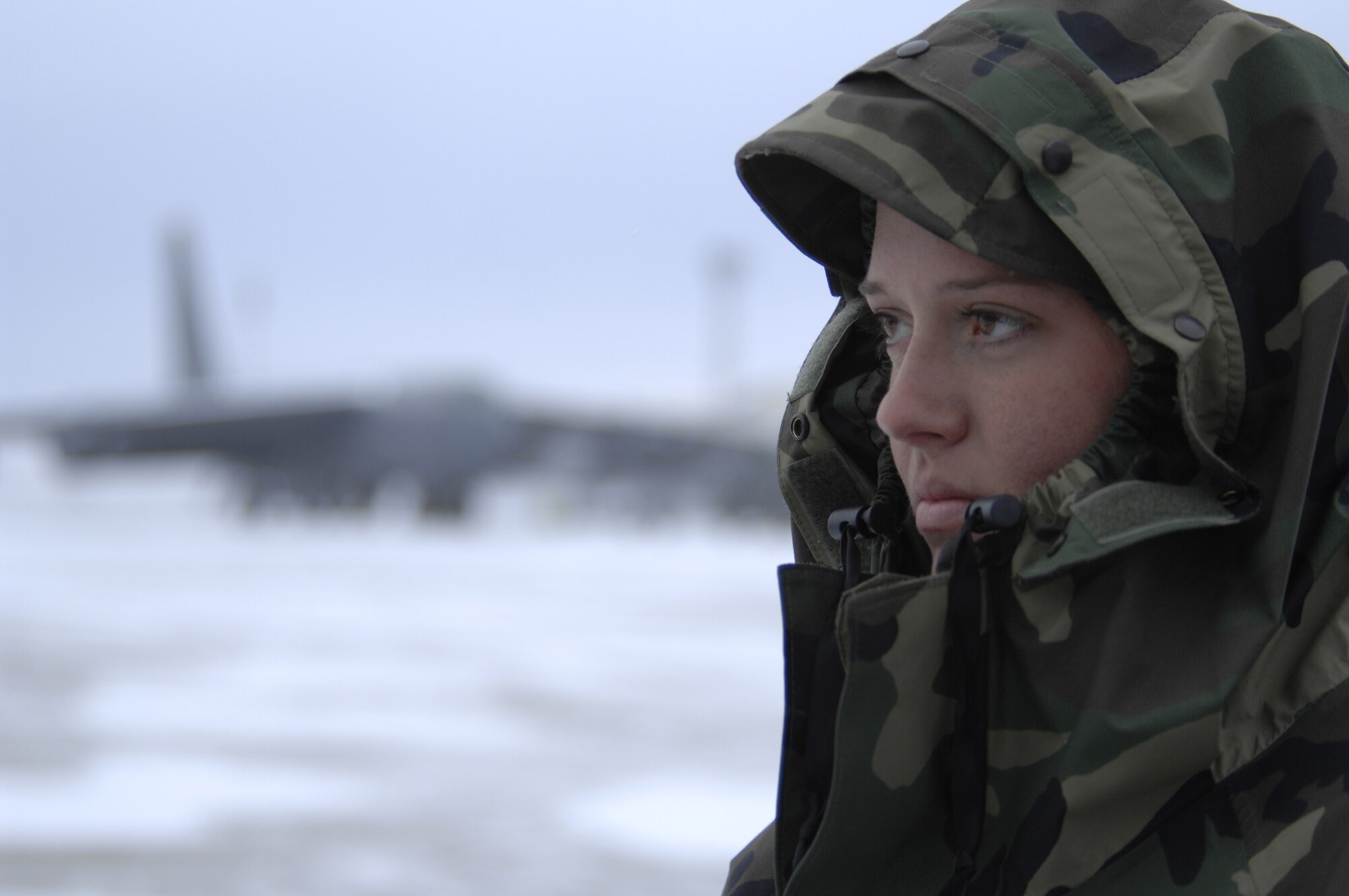 MINOT AIR FORCE BASE, N.D. -- Airman Shaina Smith, 5th Aircraft Maintenance Squadron crew chief, waits on the flight line here before marshaling a B-52H Stratofortress Jan. 8. Airman Smith worked though freezing temperatures and gusts of wind up to 50 knots. (U.S. Air Force photo by Airman 1st Class Christopher Boitz)