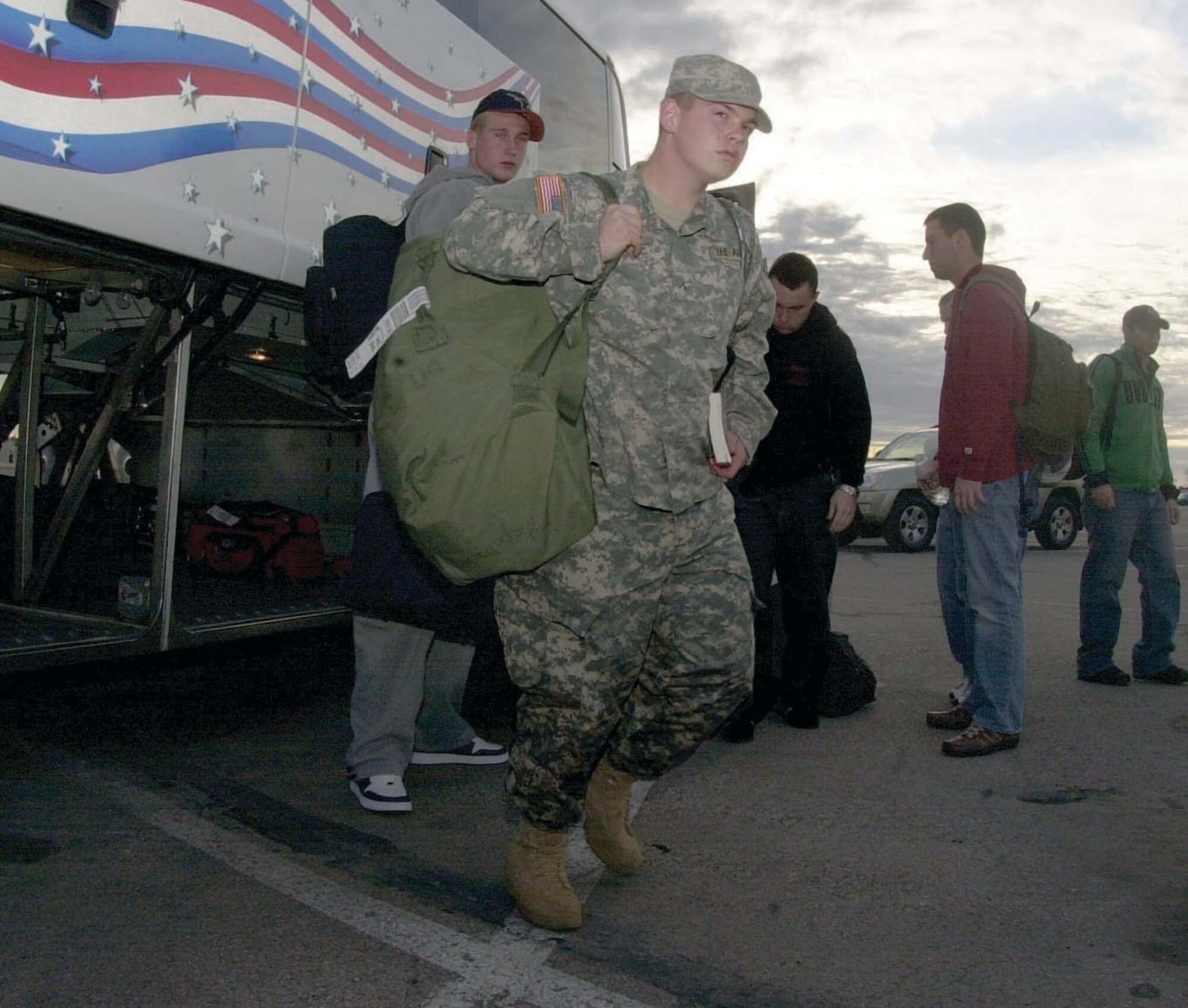 Army Pvt. Christopher Fitzpatrick returns to Goodfellow Tuesday after visiting his family in Davenport, Iowa.  Private Fitzpatrick was one of more than 600 students scheduled to arrive via bus at the base commissary parking lot Tuesday, marking the end of the Holiday Exodus period. 
