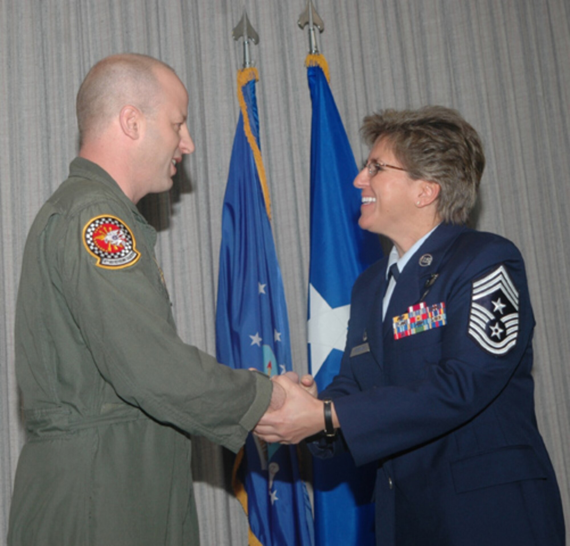 GRISSOM AIR RESERVE BASE, Ind.,--  Air Force Reservist Jeffrey Maier, 74th Air Refueling Squadron, is congratulated by Command Chief Master Sgt. Peri Rogowski on his promotion to chief master sergeant during a special recognition ceremony.  (U.S. Air Force photo/Senior Airman Chris Bolen)