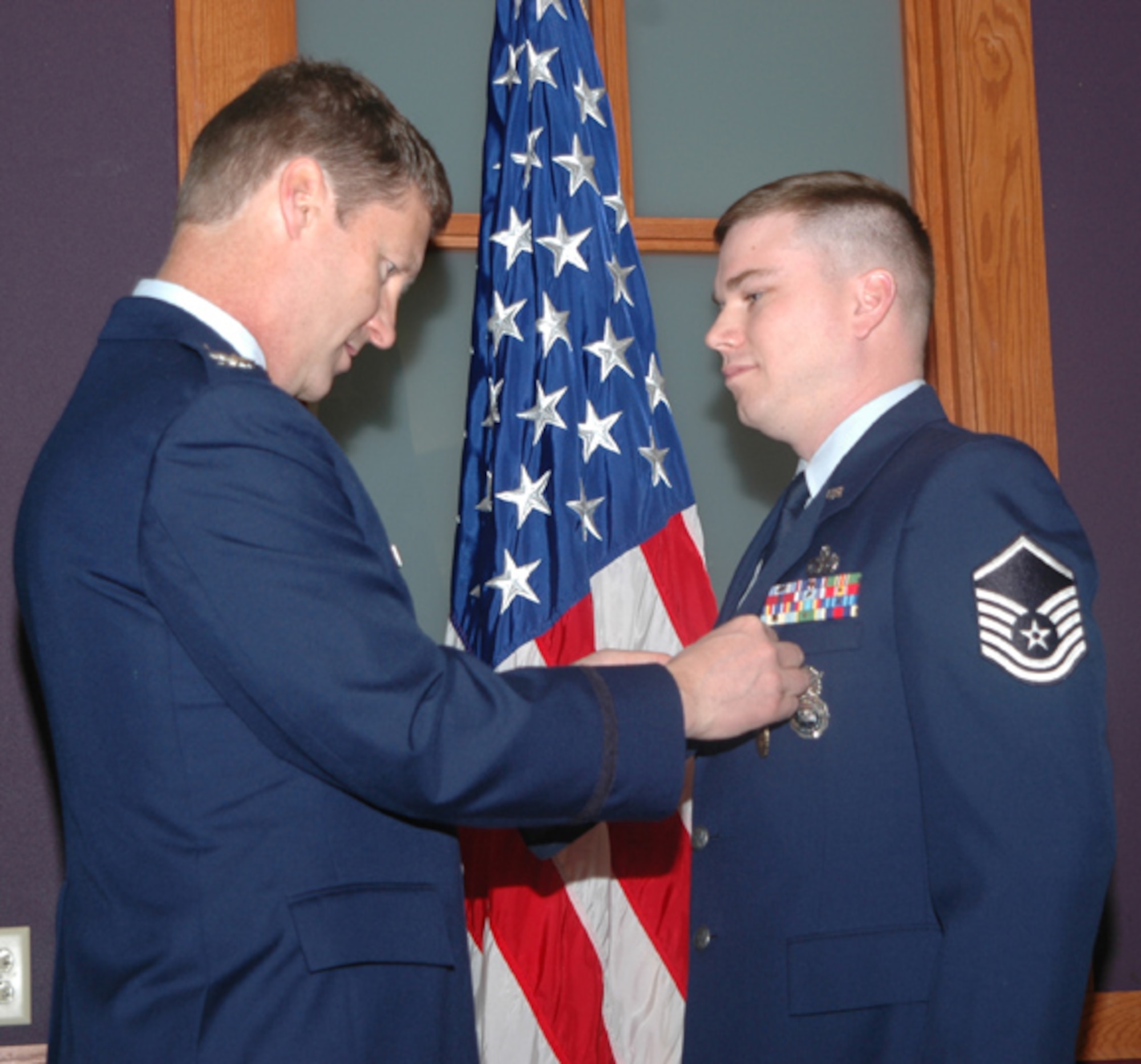 GRISSOM AIR RESERVE BASE, Ind.,--Master Sgt. Jackson Barnett, 434th Security Forces Squadron, receives the Air Force Meritorious Service Medal from Col. Douglas McHugh, 434th Mission Support Group commander,  during a special recognition ceremony at Grissom ARB. (U.S. Air Force photo/Senior Airman Chris Bolen)