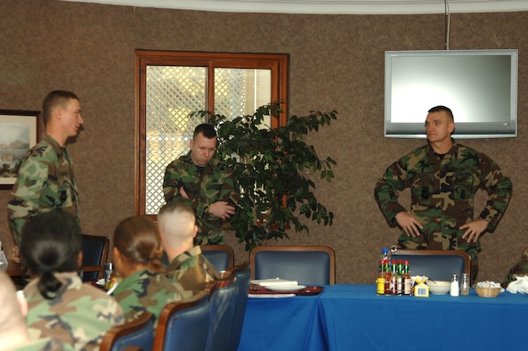 Col. Neil Radar (right), U.S. Air Forces in Europes director of security forces, and Senior Master Sgt. Kevin Beaty (center), USAFE security forces manager, answers a question posed by Airman 1st Class Michael Reed, 39th Security Forces Squadron, during a breakfast with 39th SFS Airmen Jan. 9 at the Sultan's Inn Dining Facility. (U.S. Air Force photo by Airman 1st Class Kelly LeGuillon)