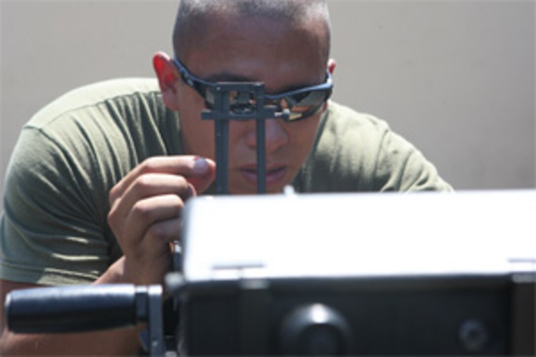 Sgt. Roland J. Dehoyos, from San Antonio, successfully mounted an MK-19 automatic grenade launcher and turned his concentration to proper sight adjustment. Though Dehoyos is a rifleman with 2nd Battalion, 4th Marine Regiment, 1st Marine Division, he didn't receive the same training as the machine gunners in his battalion while at the School of Infantry. The short class may help during future operations on the battlefield.