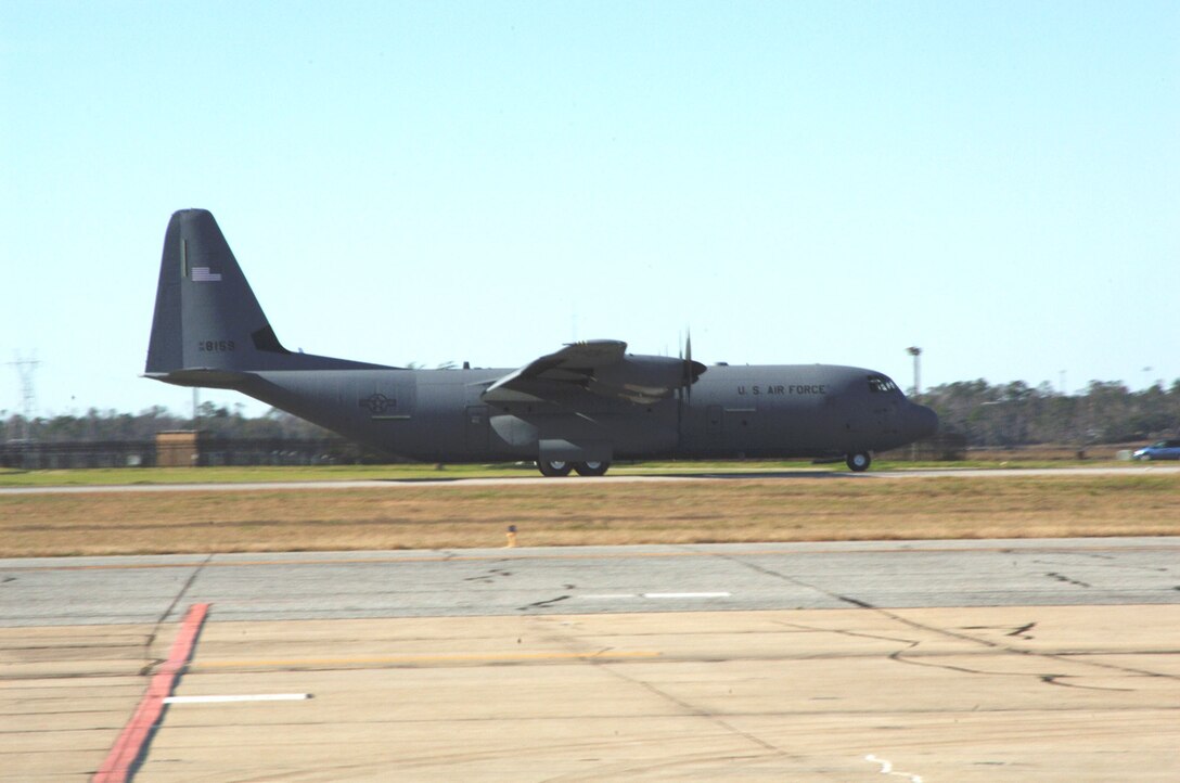 A crew from the 815th Airlift Squadron lands aircraft 8159 here Jan. 9 completing delivery of all 18 J-model aircraft from the manufacturer. The aircraft is a C-130J-30 an extended version of the Super Hercules.