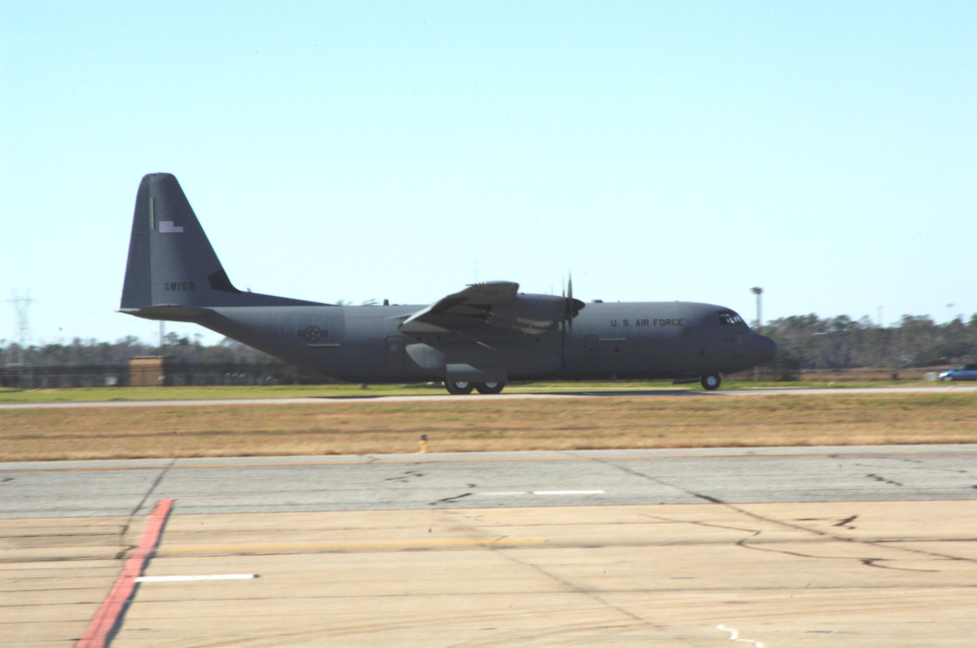 A crew from the 815th Airlift Squadron lands aircraft 8159 here Jan. 9 completing delivery of all 18 J-model aircraft from the manufacturer. The aircraft is a C-130J-30 an extended version of the Super Hercules.