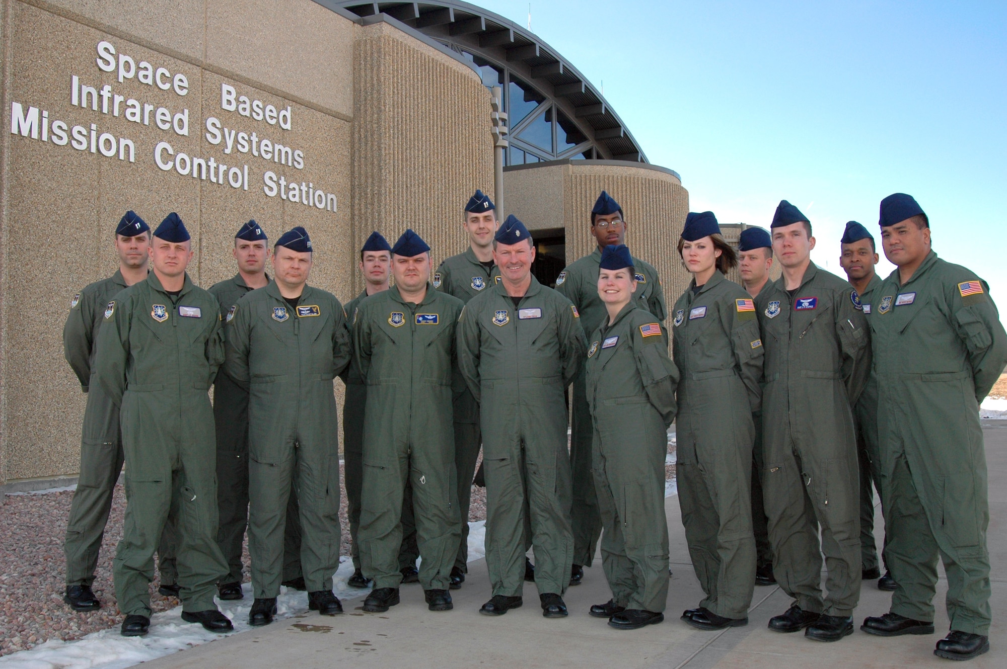 SCHRIEVER AIR FORCE BASE, Colo. -- The 460th Operations Group Detachment 1 here will provide training and support for Space Based Infrared Systems students. Training will begin Jan. 12. The Airmen of 460th OG Det. 1 are, from left: (front) Staff Sgt. James Moore, Capt. Tom Roetzler, Staff Sgt. Travis Wright, Lt. Col. Myland Pride, Staff Sgts. Lori Browning, Tarah Norris, John Chavez and Narciso "Butch" Bautista; (rear) Capts. Paul Contoveros and Aaron Teltschik, Staff Sgt. Derek Miller, Capt. David Washer, Tech. Sgts. Joseph Johnson, Aaron Dickson and Tony Handy. (U.S. Air Force photo/Staff Sgt. Don Branum)