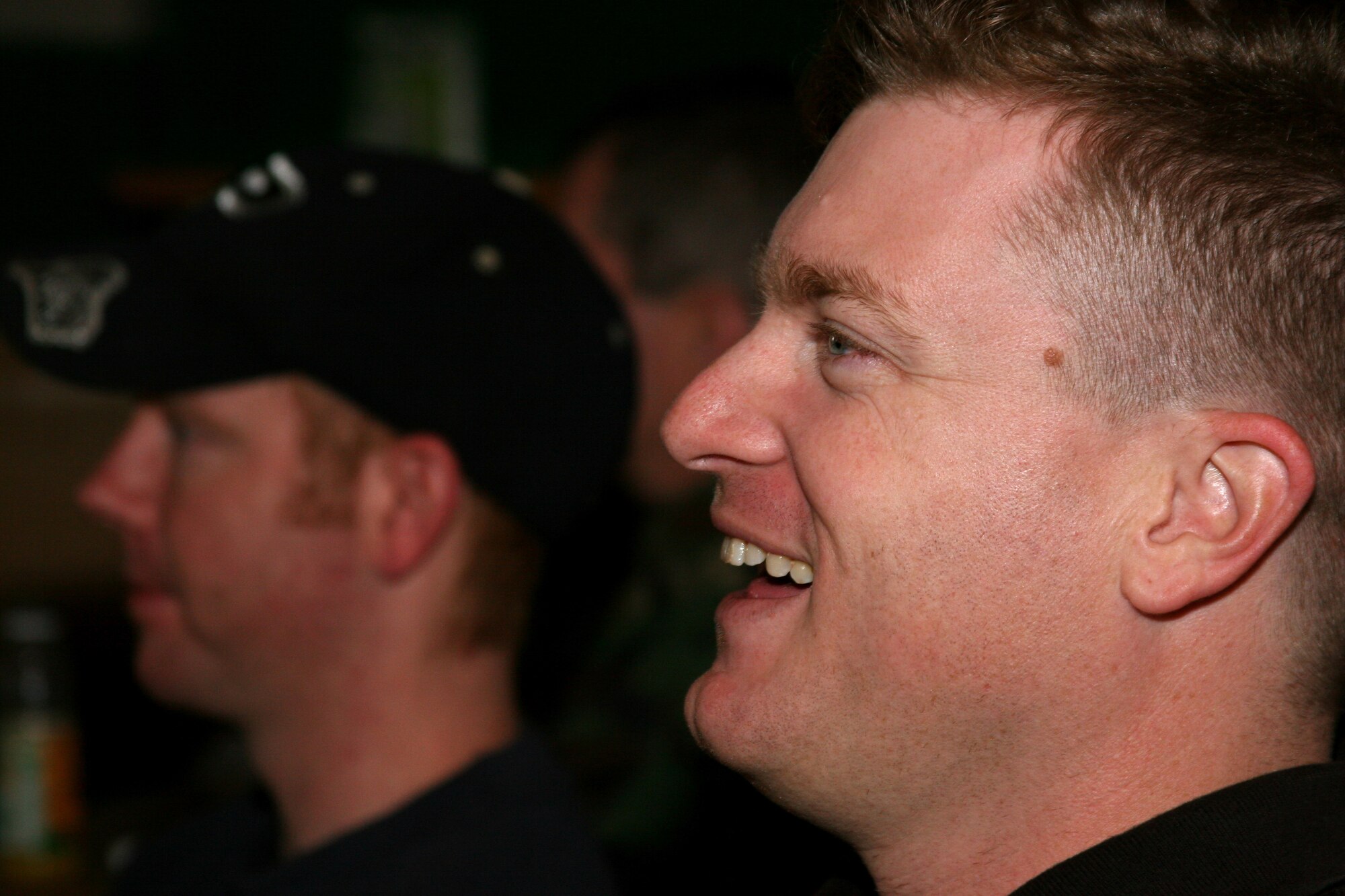 GRISSOM AIR RESERVE BASE, Ind. -- Senior Airman  Mike Maddux, right, and Staff Sgt. Jason Barnett, watch the first round playoff game with Indianapolis Colts against the Kansas City Chiefs during the January unit training assembly. The 434th Services Flight hosted a tailgating part for unit members at Chocks during the game.  (U.S. Air Force photo/Senior Airman Omar Delacruz)