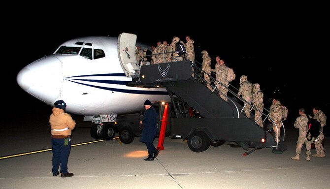 WRIGHT-PATTERSON AFB, Ohio -- Approximately 35 Air Force reservists assigned to the 445th Airlift Wing's Civil Engineer Squadron deploy on a charter aircraft.  This was the last of three aircraft since January 1st to transport a total of 175 reservists overseas to support the Global War on Terrorism.  The majority of the deploying reservists are from the 445th's  Civil Engineer and 87 Aerial Port Squadrons as well as members of the Aeromedical Staging, Maintenance, and Logistics Readiness Squadrons, and Services and Mission Support Flights. (U.S. Air Force Photo/Maj. Ted Theopolos)