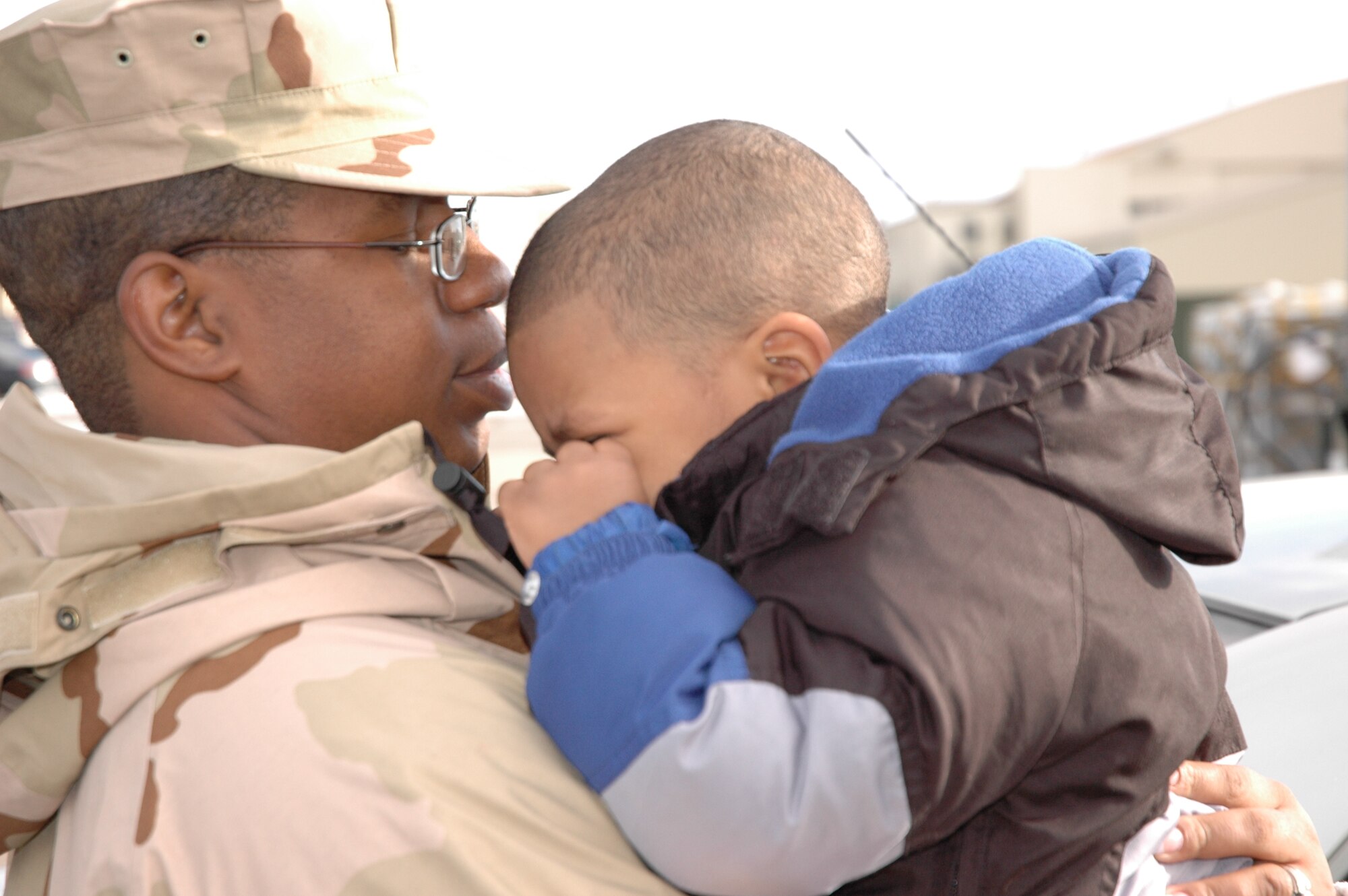 MOUNTAIN HOME AIR FORCE BASE, Idaho -- Wiping tears from his eyes, Jaedon Sisk says goodbye to his father, Staf Sgt. Brandon Sisk, before the sergeant boarded an aircraft to deploy to Southwest Asia. The sergeant was one of nearly 250 Airmen from the 366th Fighter Wing who deployed Jan. 7 and 8 in support of the Global War on Terrorism. The sergeant is assigned to the 366th Aircraft Maintenance Squadron. Air Force photo by Master Sgt. Brian S. Orban