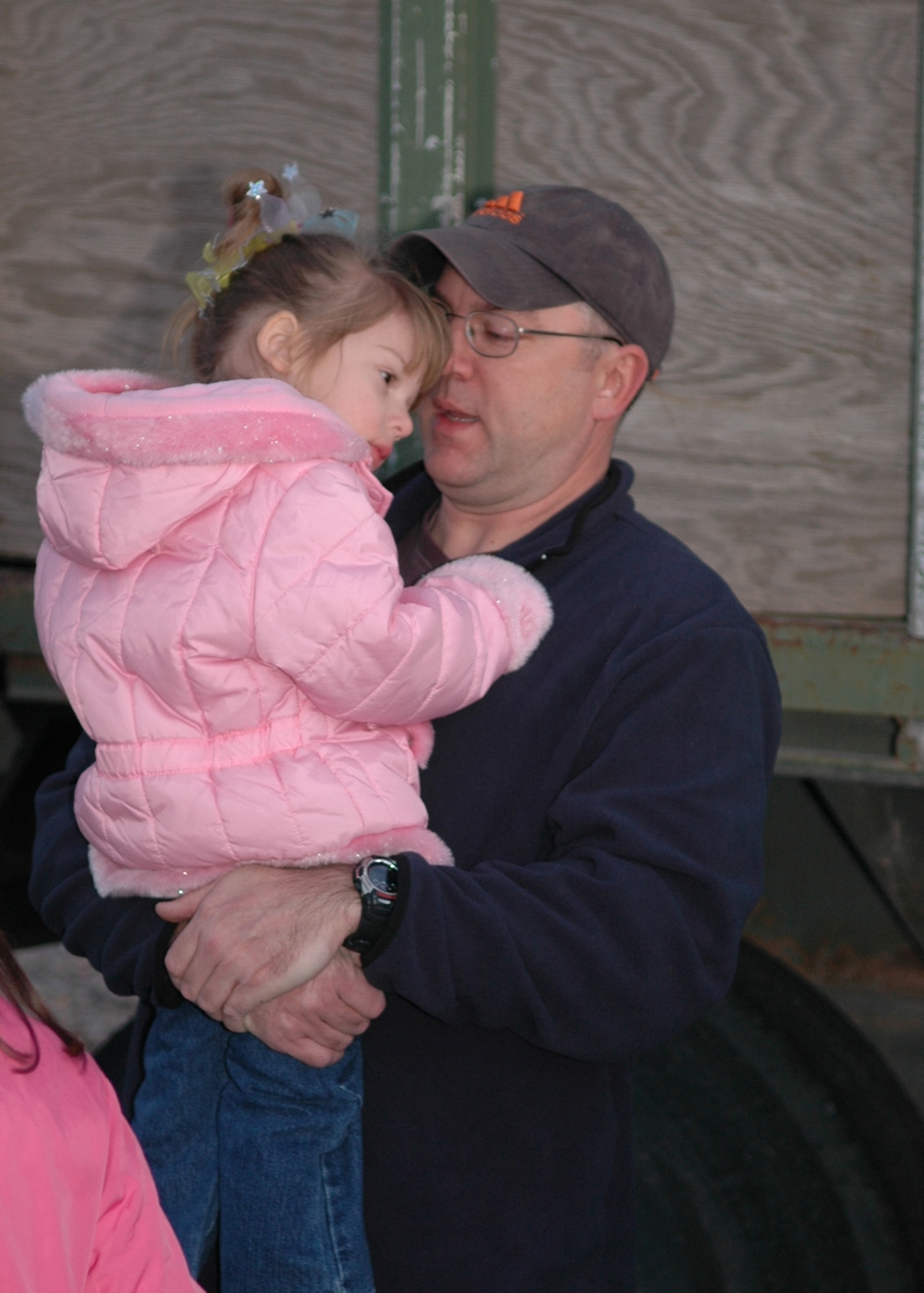 Tech. Sgt. Bill Phreaner, 49th Aircraft Maintenance Squadron, holds his three-year-old daughter, McKenna, before he deploys to Korea Monday. More than 300 Airmen are going on this deployment from Holloman (U.S. Air Force photo by Airman Jamal Sutter)