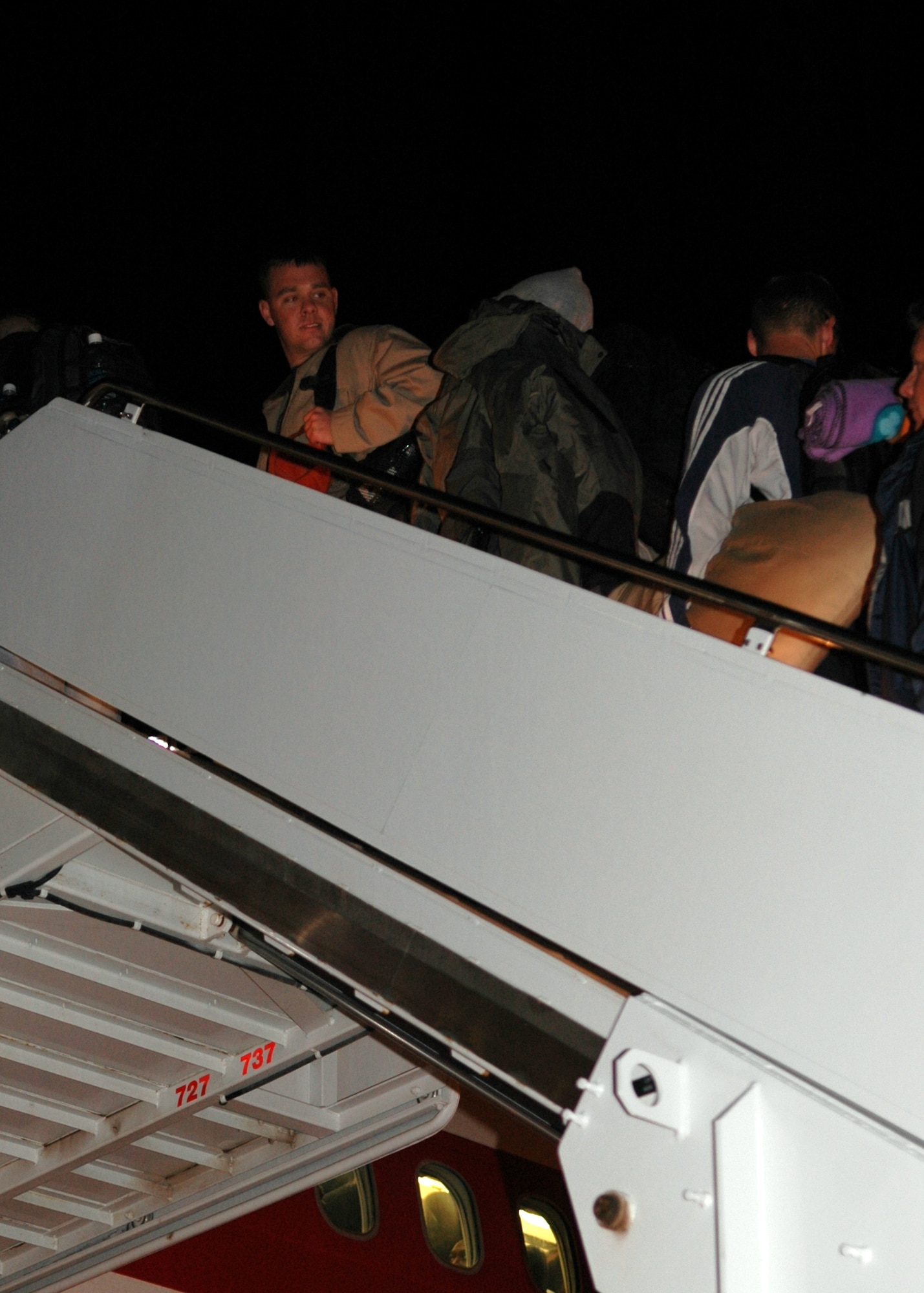 Holloman Airmen board the aircraft that will take them to the Republic of Korea Monday. Approximately a squadron of F-117As and about 300 Airman are going on this preplanned deployment. (U.S. Air Force photo by Airman Jamal Sutter)