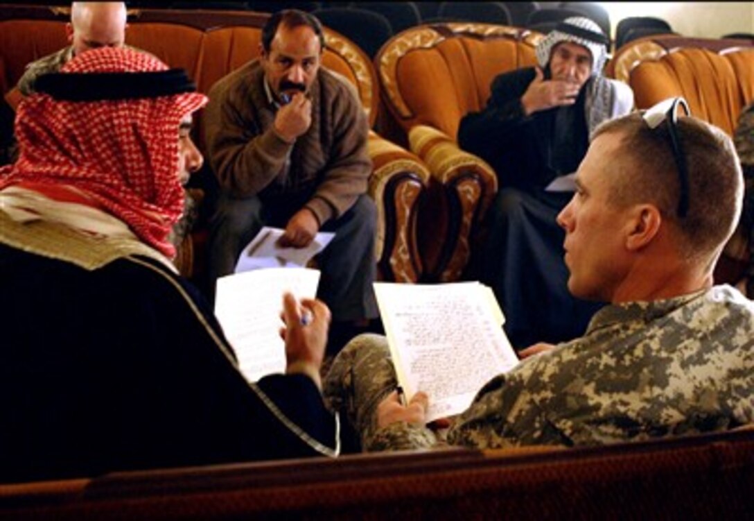 U.S. Army Lt. Col. Scott Efflandt, the commander of 2nd Battalion, 8th Cavalry Regiment, addresses the concerns of local community leaders in Tarmiyah, Iraq, Jan. 6, 2007.