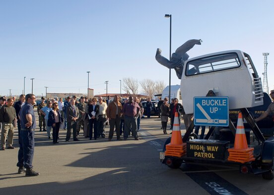 Members of the 95th Air Base Wing observe the effects of not wearing seatbelts during a rollover situation. The second annual 95th ABW Safety Day on Jan. 10, 2007, focused on providing safety information to wing personnel through interactive demonstrations. (Photo by Mike Cassidy)