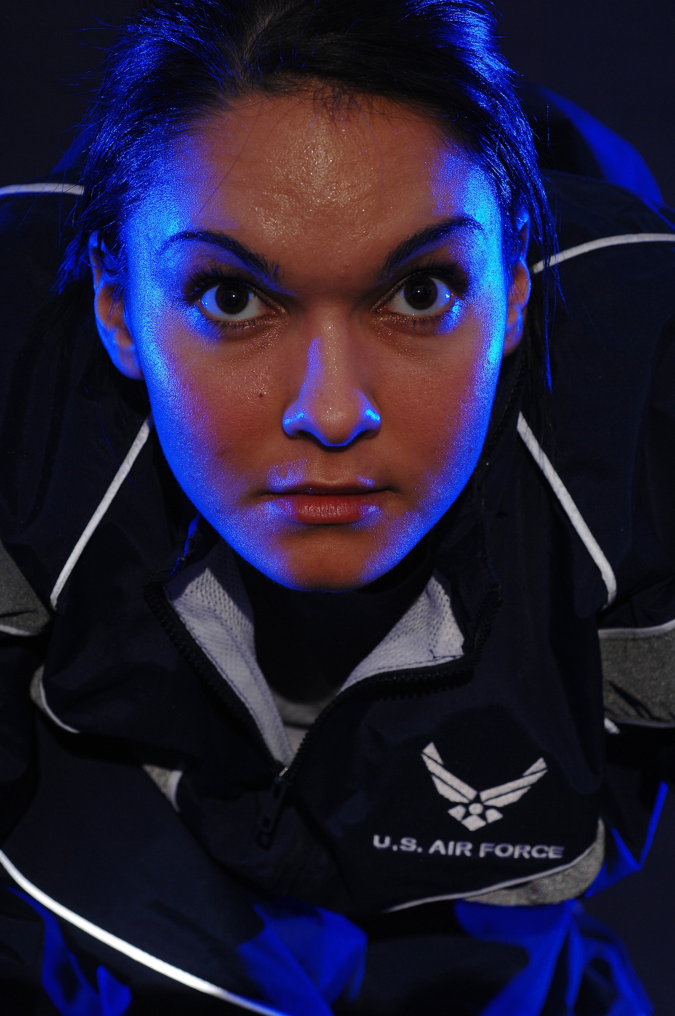 Airman 1st Class Savannah Orozco is photographed in her physical training uniform for a fitness poster Jan. 5 in the multimedia studio at McChord Air Force Base, Wash.  Airman Orozco is with the 62nd Operations Support Squadron there.   (U.S. Air Force photo/Abner Guzman) 