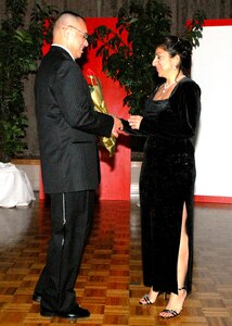 Roger Garcia and Diana Prechtel model formal wear during the "Simply Elegant" segment of the fashion show Jan. 5 in the Gateway Club. Proceeds from the evening will go into the African-American Heritage scholarship fund. (USAF photo by Alan Boedeker)