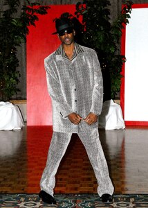 Darius Kersh wows the crowd with his ensemble during the opening scene, "A Look
Back in Time," at the 2007 fashion show, "History of Fashion ... A Night to Remember." Proceeds raised from the fashion show go to the African-American Heritage scholarship fund. (USAF photo by Alan Boedeker)
