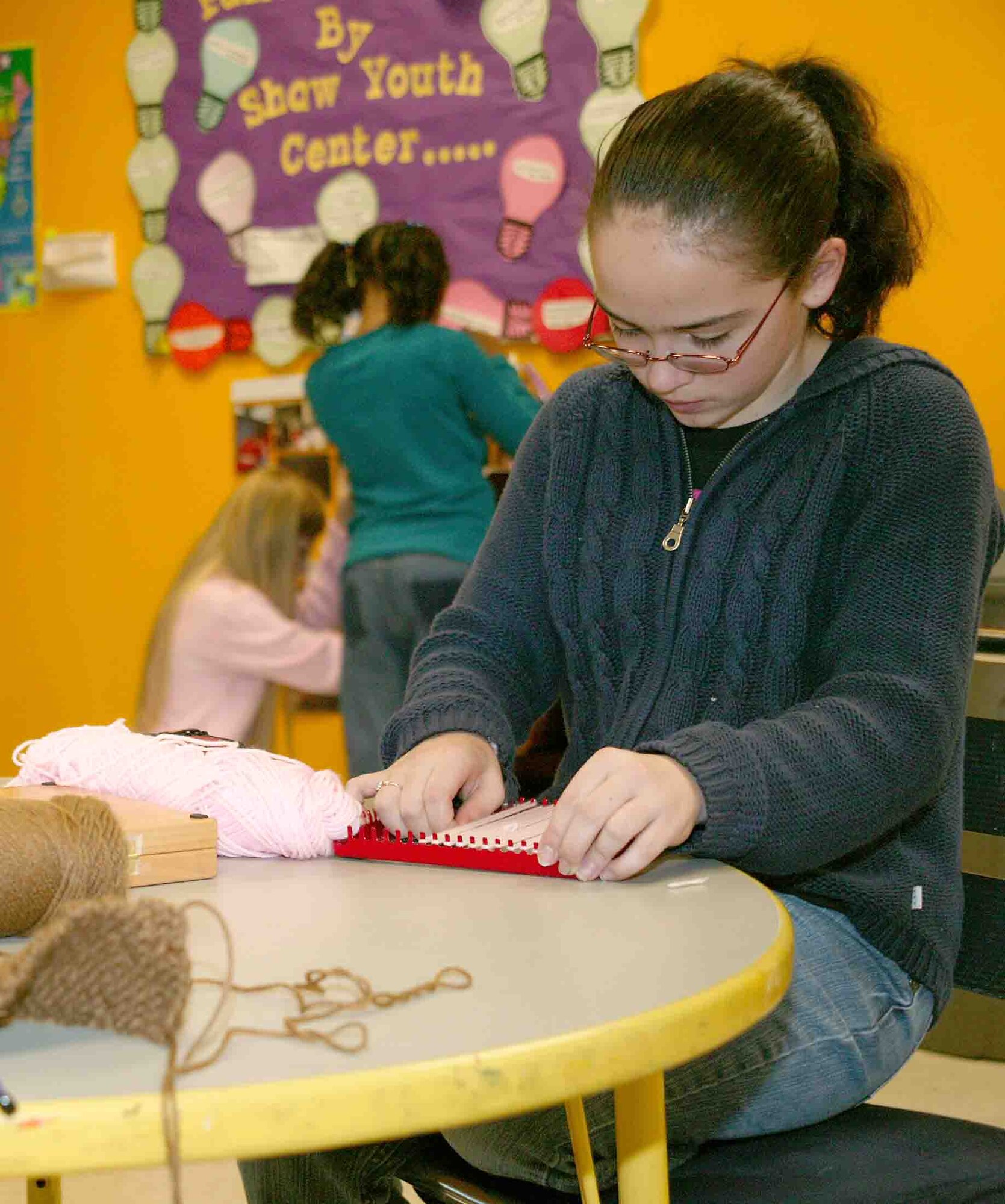 SHAW AIR FORCE BASE, S.C. -- Chevann, daughter of Jesenia and Tech. Sgt. Zachary Starnes, assigned to the 607th Air Intelligence Squadron at Osan Air Base, Korea, learns how to knit. (U.S. Air Force photo/Senior Airman John Gordinier)