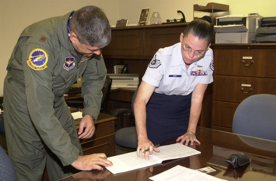 (Photo by 2nd Lt Lori Wise) A customer gets assistance from Sergeant Moody.