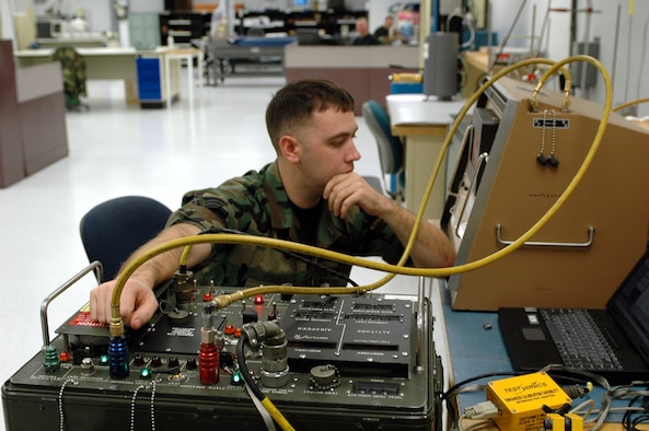 Senior Airman Jeremiah Robinson, Precision Measurement Equipment Laboratory journeyman, tests an altitude airspeed calibrator. The PMEL is preparing for an audit by the Air Force Metrology and Calibration Program Jan. 22 to Jan. 30. The audit will evaluate six categories including technicians’ competence, the quality system, facility and environment, and will certify the Air Force’s largest laboratory procedures and measurements for two more years. (U.S. Air Force photo by 1st Lt. Lindsey Hahn)