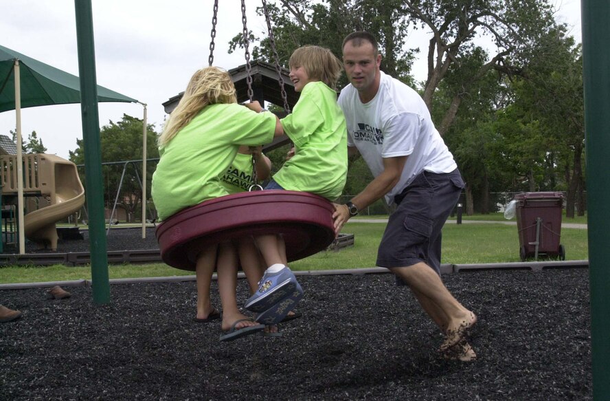 (Photo by 1st Lt Paula Bissonette) Capt Jeremiah Gentry, 33rd Flying Training Squadron instructor pilot, volunteered as a Camp Tomahawk counselor during the 30th annual event June 7 through today. The girls, who camped Monday through today, spent some time at the base park Wednesday. Forty underprivileged children attended this year’s camp.