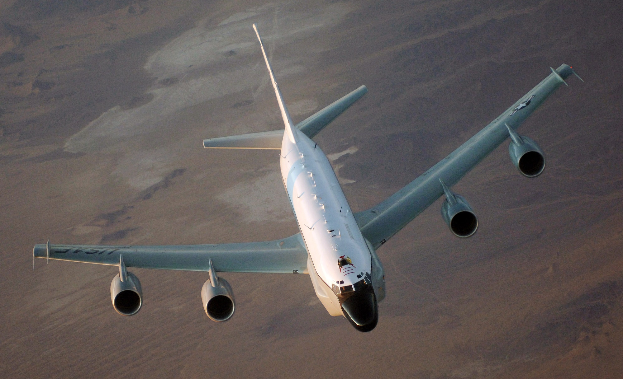 An RC-135 Rivet Joint flies over Afghanistan Jan. 9. The intelligence reconnaissance aircraft carries a 34-member crew has been consistently deployed to Southwest Asia for a milestone 6,000 days since Aug. 9, 1990, just before Operation Desert Shield. (U.S. Air Force photo/Master Sgt. Scott Wagers)