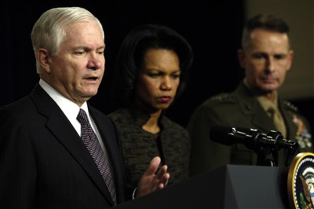 Secretary of Defense Robert M. Gates (left) accompanied by Secretary of State Condoleezza Rice (center) and Chairman of the Joint Chiefs of Staff Gen. Peter Pace, U.S. Marine Corps, responds to questions at a news briefing in Washington, D.C., on Jan. 11, 2007.  