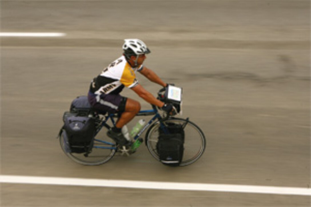 Ed F. Acevedo, a former Army officer, rides the last few miles of his 4,288-mile ride from St. Augustine, Fla., to Camp Pendleton, Calif. Acevedo hoped to raise awareness about wounded veterans from past and present during his journey.