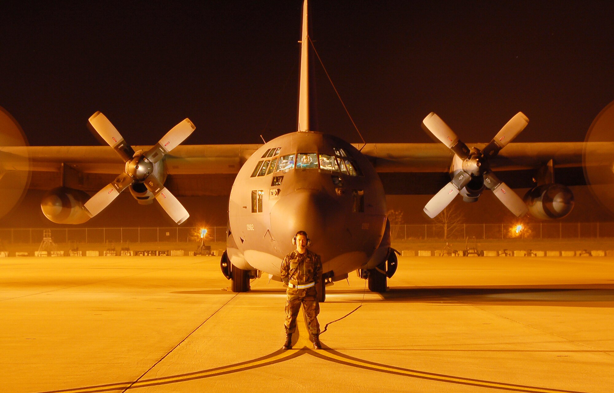 Senior Airman Eric Weinfurter, a guidance and control specialist with the 723rd AMXS, stands by during an HC-130P engine run Jan. 9. (U.S. Air Force photo by Tech Sgt. Parker Gyokeres)
