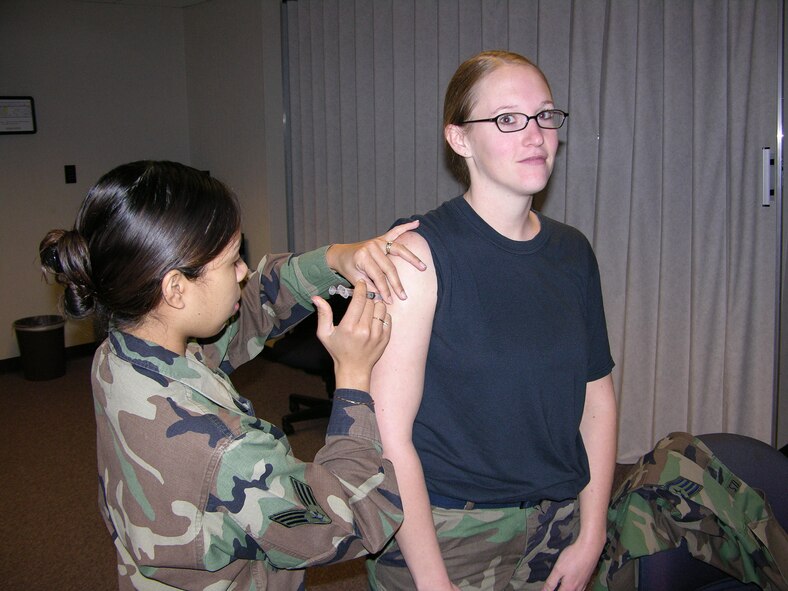 Staff Sgt. Tonya Williams receives her flu shot during the January unit training assembly. Sergeant Williams is a member of the 916th Air Refueling Wing, Air Force Reserve and works as part of wing staff. Reservists must be immunized against deadly flu viruses each year as part of their medical fitness for worldwide deployment.  (U.S. Air Force photo/Staff Sgt. Scott Mathews      