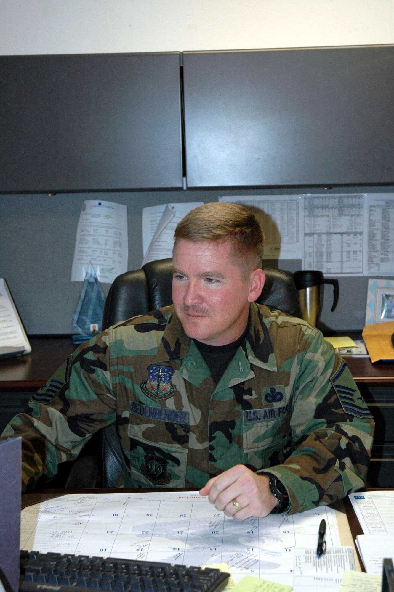 Master Sgt. Jim Bedenbender, 741st Missile Security Forces Squadron, tallies the final numbers from the Salvation Army's holiday red kettle drive. He spearheaded the volunteer efforts of Malmstrom personnel.