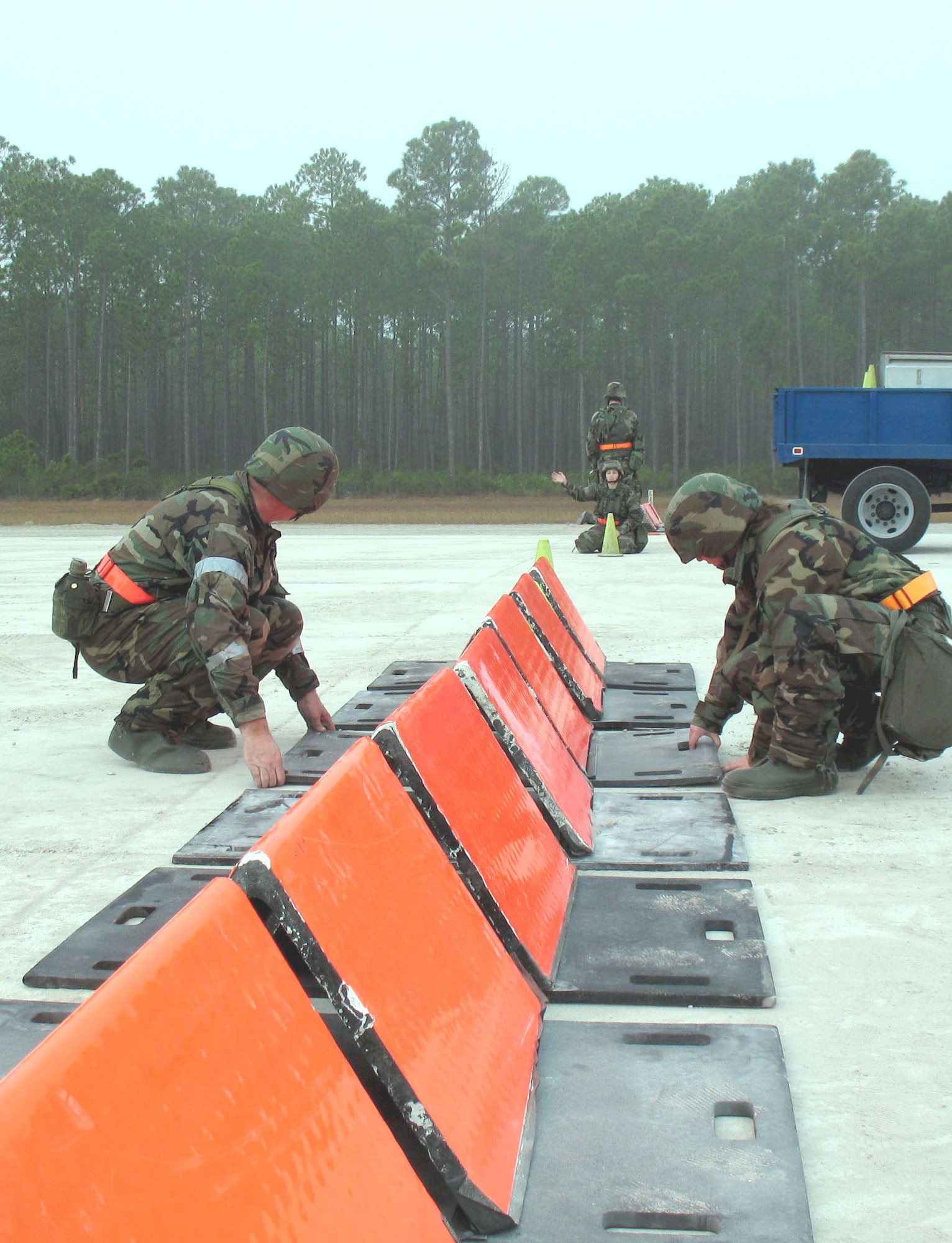 Engineering assistants from the 341st Civil Engineer Squadron work together to set up another section of the minimum operating strip, the usable area of the damaged runway. Malmstrom’s CES members worked side by side with other active-duty Air Force members as well as those from the National Guard and Reserve components.
