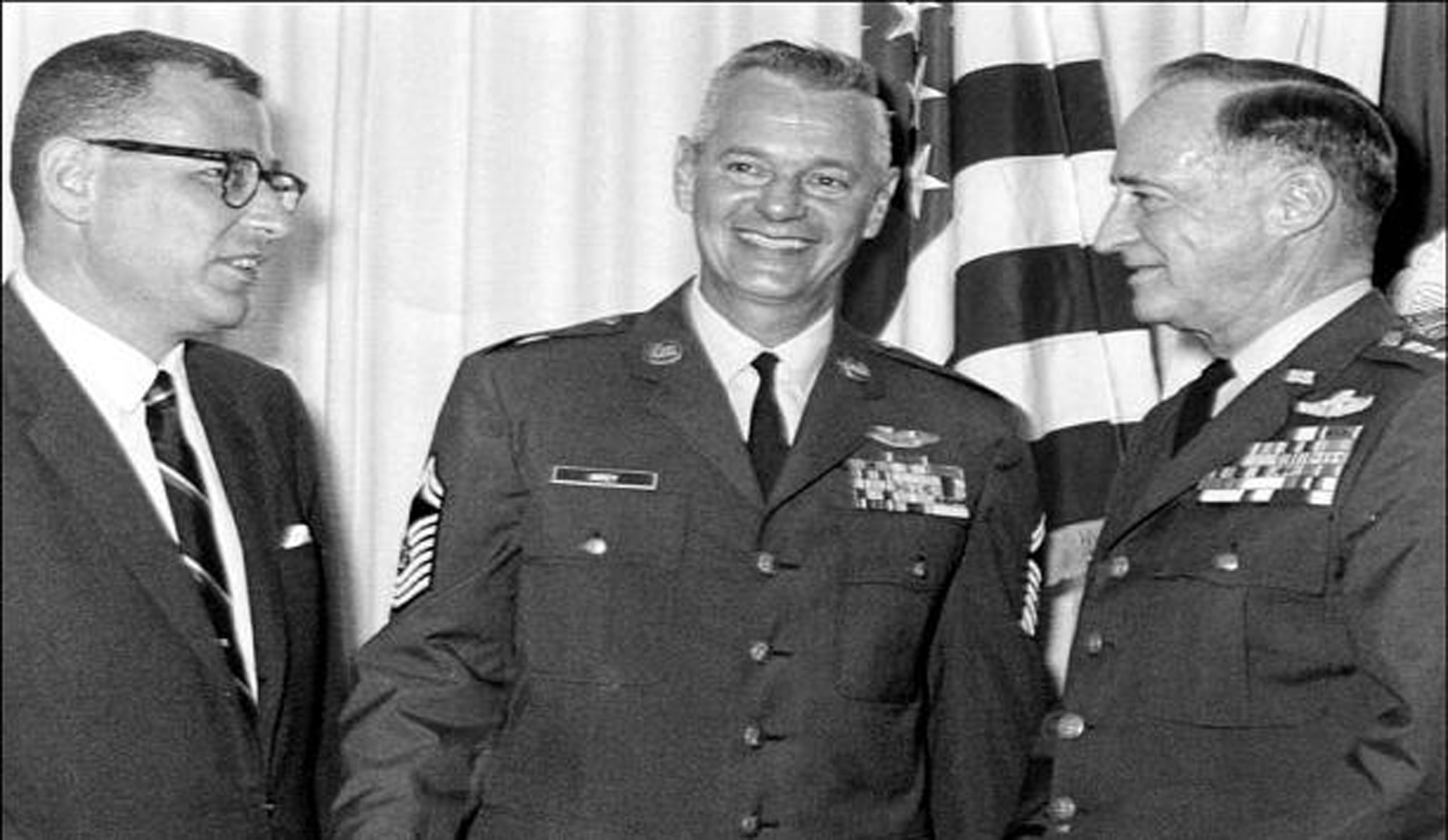 Chief Master Sgt. of the Air Force  Paul W. Airey (center) was advisor  to  Secretary  of  the Air Force Harold Brown (left) and Chief of Staff of the Air Force Gen. John  P.  McConnell (right) on matters  concerning  welfare, effective utilization and progress of the enlisted members of the Air Force. He was the first chief master sergeant appointed to this position April 3, 1967.