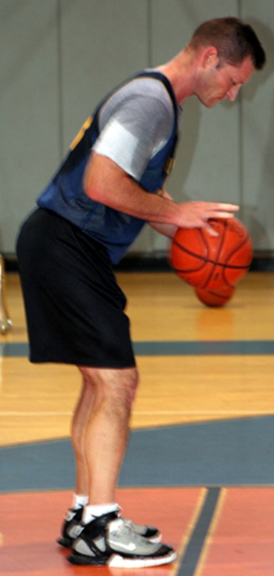 A member of the 505th Command and Control Wing prepares to shoot from the free throw line after being fouled by the Special Operations Squadron/823rd RED HORSE Squadron. (U.S. Air Force Photograph by Staff Sgt. Kelly Ogden)