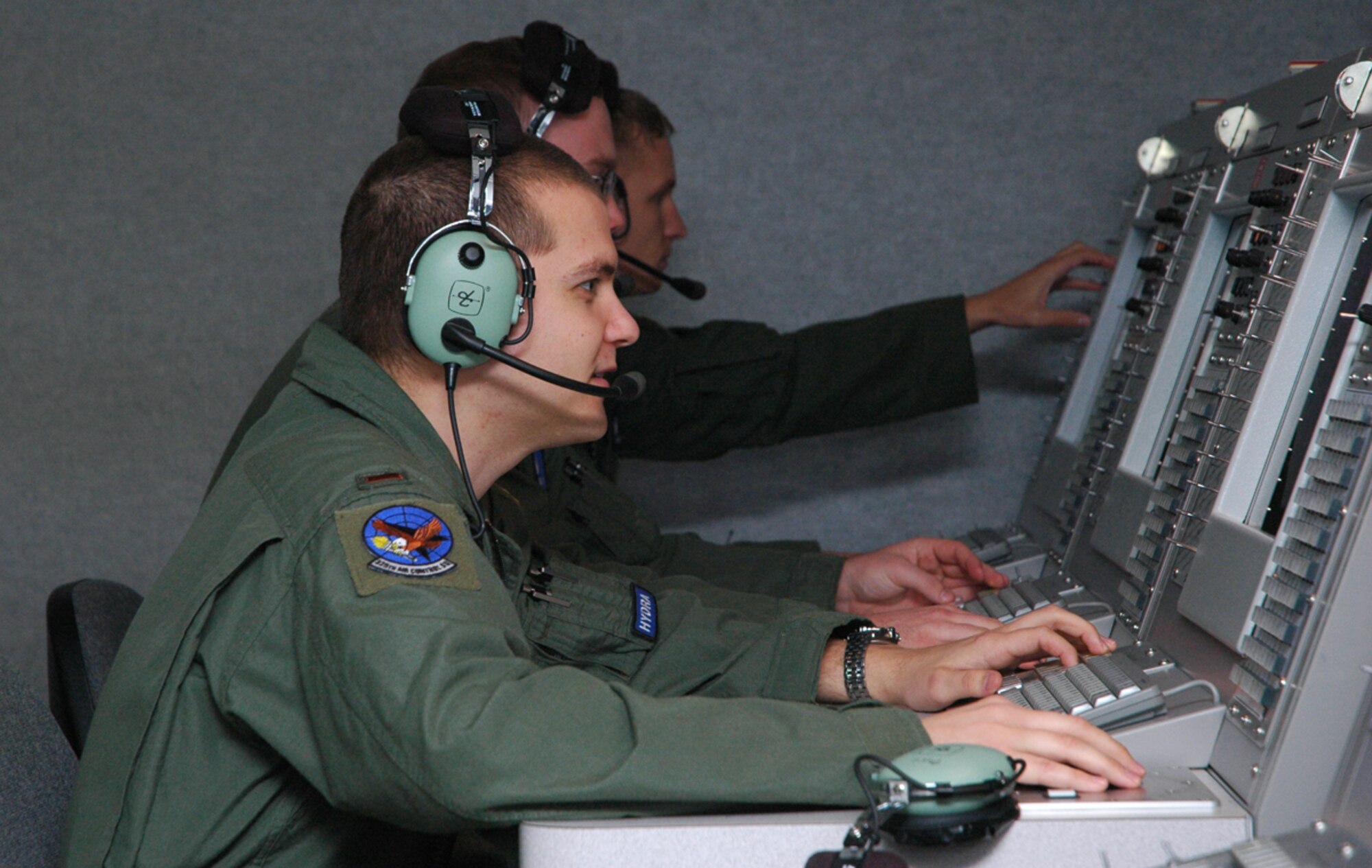 2nd Lts. Chris Stewart, Nick Petersen and Karl Deren, ABM students, are controlling MU-2s through simulation training for their undergraduate ABM class.