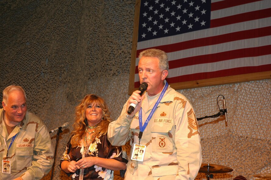 Senior Master Sgt. Wendell Peacock, an Air Force reservist at Robins, takes the stage with country music star Jamie O’Neal at an Operation Season’s Greetings tour event.  Sergeant Peacock will join Ms. O’Neal on stage again Saturday at the Grand Ole Opry.  U.S. Air Force photo
