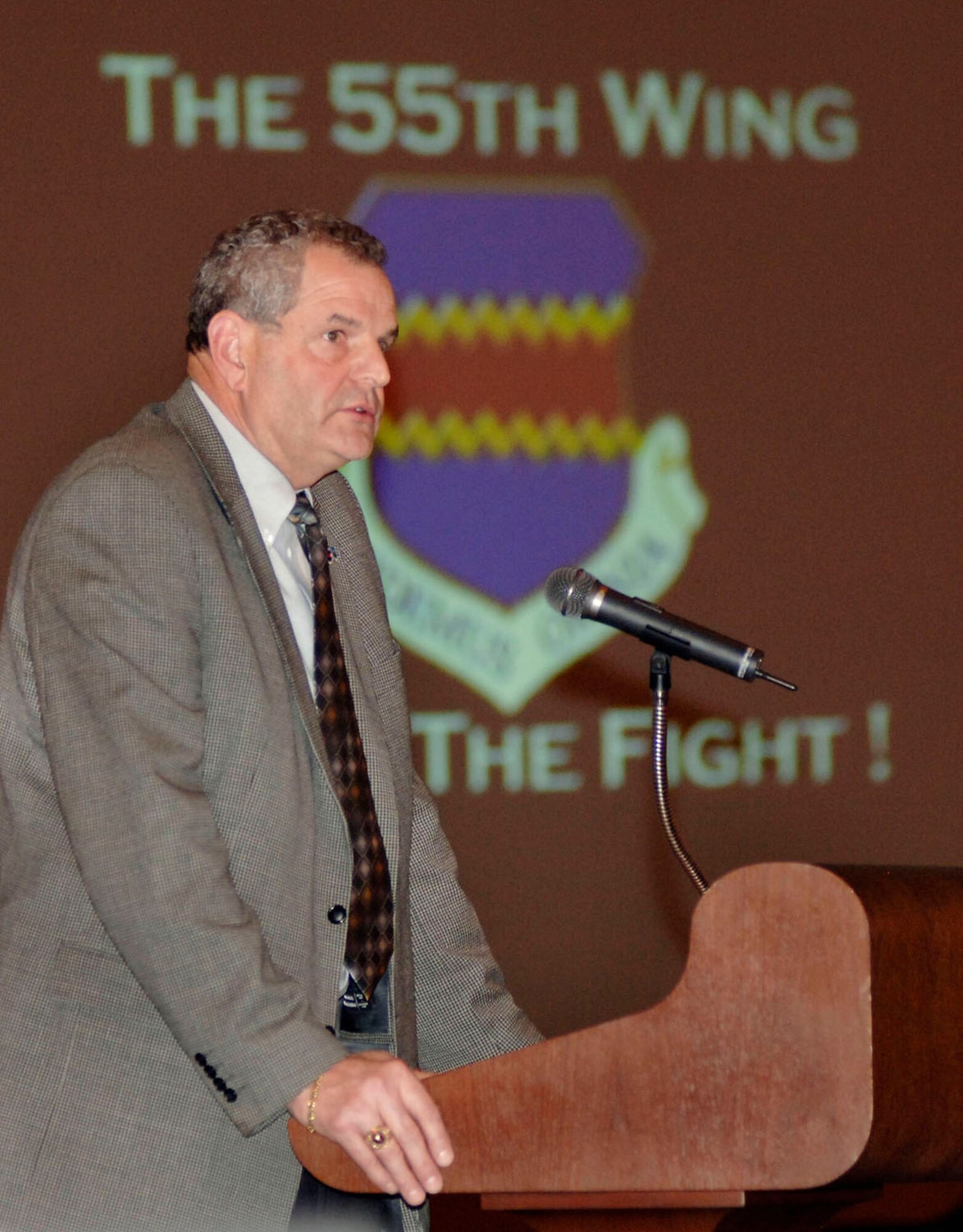 Retired Air Force Col. David Wolfe reminisces about the early days of the 55th Wing's deployment to Southwest Asia during a ceremony at Offutt Air Force Base, Neb., Jan. 11, celebrating 6,000 straight days of deployment for the unit. Colonel Wolfe was the unit's first deployed commander in 1990 and talked of the early hardships the unit endured. (U.S. Air Force photo/Daren Reehl)