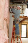 YOUNGSTOWN AIR RESERVE STATION, Ohio—Joe Hoschar, a contracted carpenter assigned to the Eagle's Nest Consolidated Club renovation project, prepares a wall in the game room for new drywall. U.S. Air Force photo/Tech. Sgt. Ken Sloat