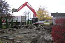 YOUNGSTOWN AIR RESERVE STATION, Ohio—As part of ongoing renovations to the Eagle's Nest Club here, a backhoe reduces the old club patio to rubble, making room for the new patio which will feature a roof to protect customers from the elements and improved seating arrangements. U.S. Air Force photo/Tech. Sgt. Ken Sloat