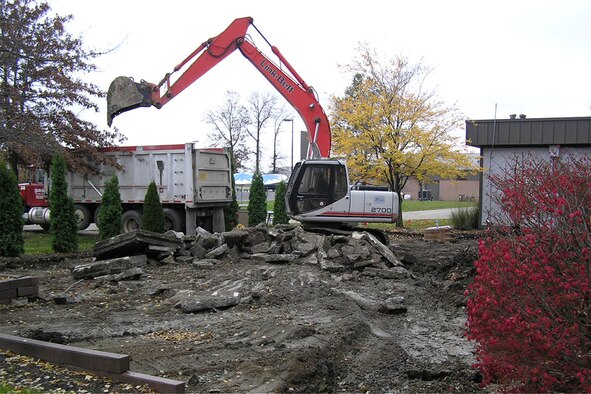 YOUNGSTOWN AIR RESERVE STATION, Ohio—As part of ongoing renovations to the Eagle's Nest Club here, a backhoe reduces the old club patio to rubble, making room for the new patio which will feature a roof to protect customers from the elements and improved seating arrangements. U.S. Air Force photo/Tech. Sgt. Ken Sloat